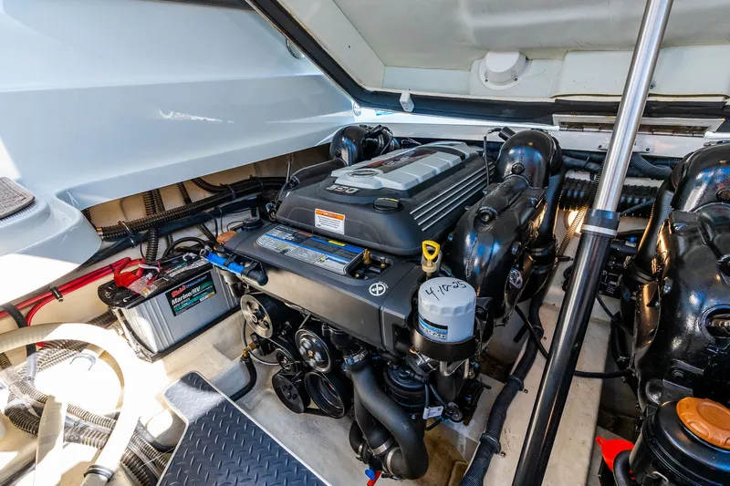 Good Morning Sunshine Yacht Photos Pics Engine compartment of a 2019 Formula 330 Crossover Bowrider, showcasing detailed mechanical components.