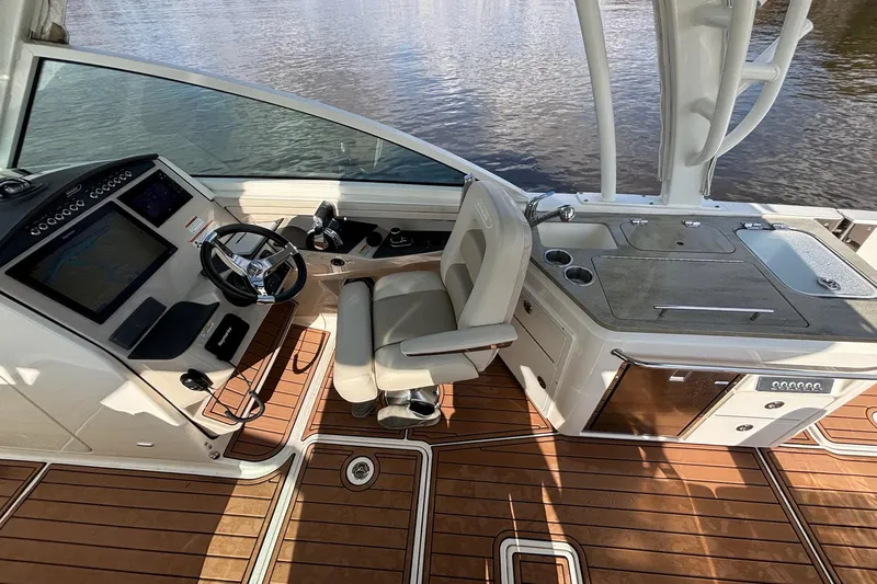  Yacht Photos Pics 2021 Boston Whaler 320 Vantage helm with luxurious seating and modern controls.