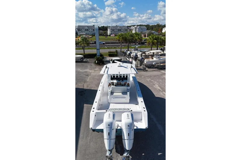  Yacht Photos Pics 2023 Jupiter 40 boat with dual engines, docked under a clear blue sky.