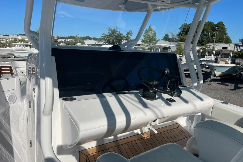  Yacht Photos Pics 2023 Jupiter 40 boat helm with steering wheel and control panel.