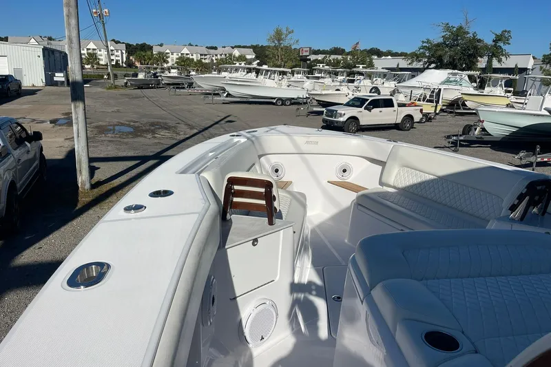  Yacht Photos Pics 2023 Jupiter 40 boat interior with seating, docked in a marina.