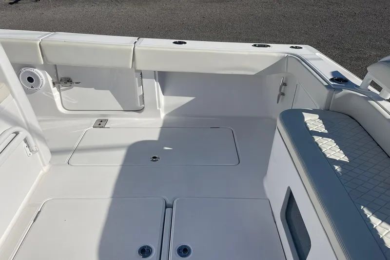  Yacht Photos Pics 2023 Jupiter 40 boat interior with white seating and storage compartments.