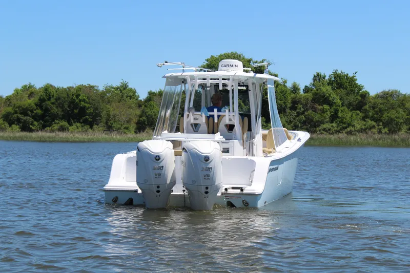  Yacht Photos Pics 2024 Sportsman Open 282 Center Console on calm water.