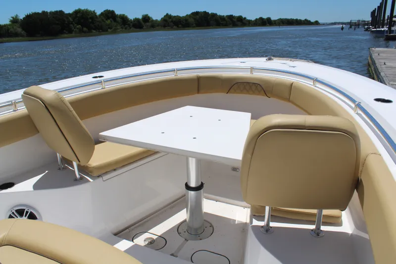  Yacht Photos Pics 2024 Sportsman Open 282 Center Console with seating area by the water.