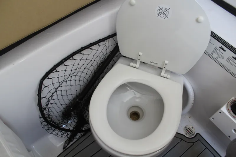  Yacht Photos Pics 2024 Sportsman Open 282 boat toilet with fishing net.