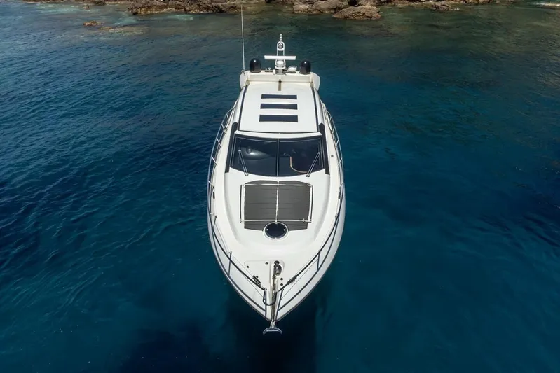 M/y Seaduced Yacht Photos Pics 2009 Sunseeker Predator 52 yacht on clear blue water, aerial view.
