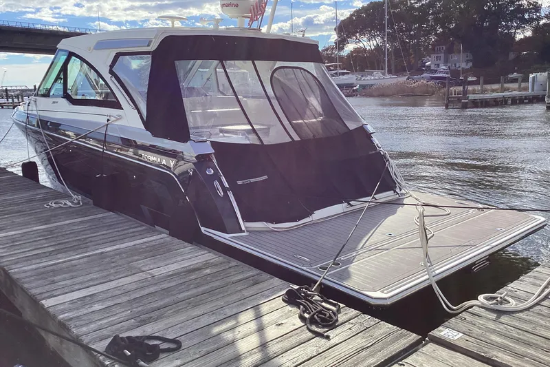 Steal Yacht Photos Pics 2020 Formula 380 Super Sport Crossover I/O docked at marina, rear view.