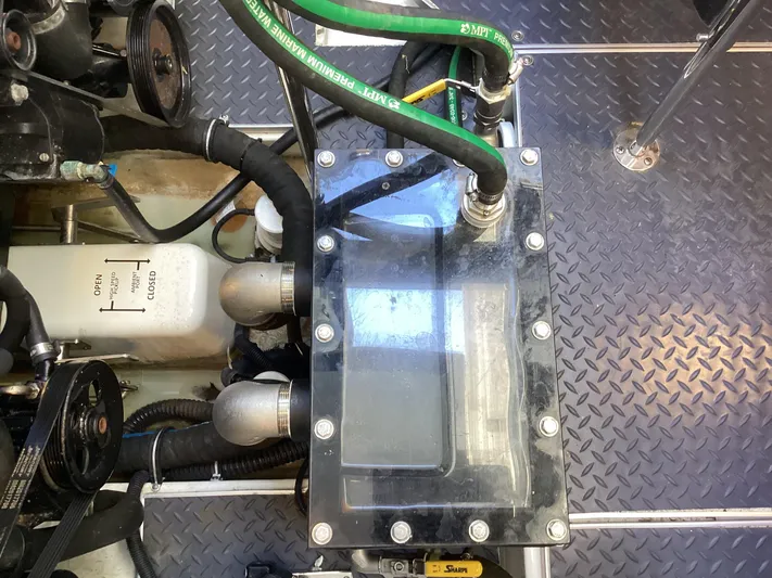 Steal Yacht Photos Pics Engine compartment of 2020 Formula 380 Super Sport Crossover with visible hoses and components.