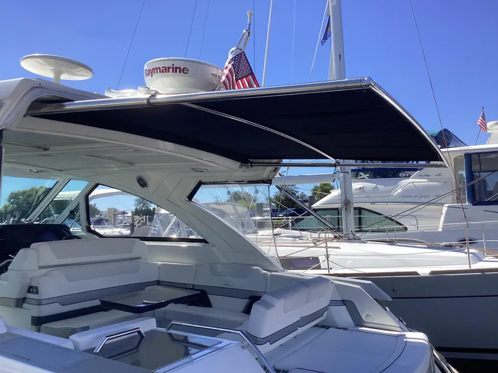 Steal Yacht Photos Pics 2020 Formula 380 Super Sport Crossover yacht with sunshade, docked in marina.