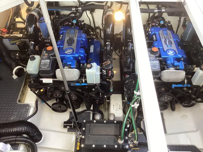 Steal Yacht Photos Pics Engine compartment of a 2020 Formula 380 Super Sport Crossover with dual blue engines.