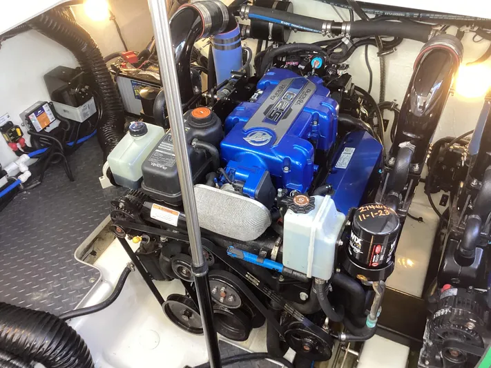 Steal Yacht Photos Pics Engine compartment of a 2020 Formula 380 Super Sport Crossover boat, showcasing detailed components.