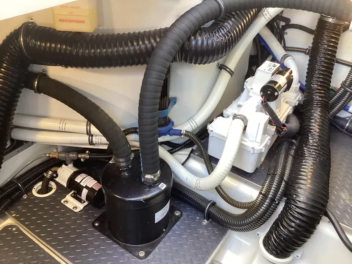 Steal Yacht Photos Pics Engine compartment of 2020 Formula 380 Super Sport Crossover with hoses and mechanical components.