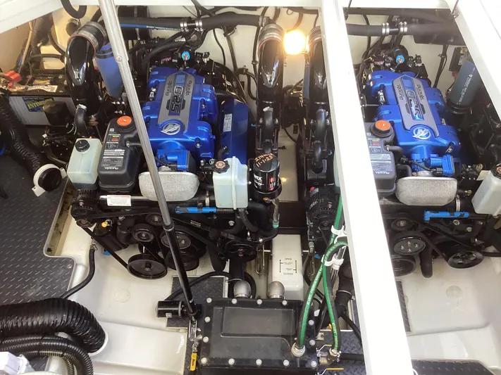 Steal Yacht Photos Pics Twin blue engines in a 2020 Formula 380 Super Sport Crossover boat engine room.