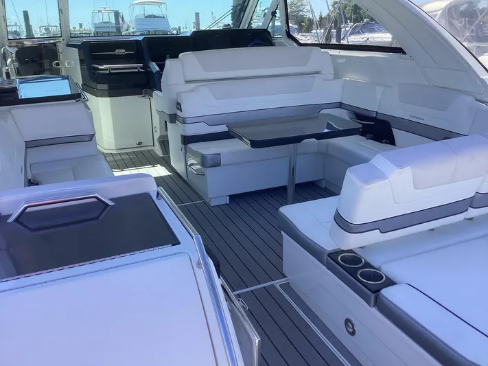 Steal Yacht Photos Pics 2020 Formula 380 Super Sport Crossover interior with white seating and sleek design.