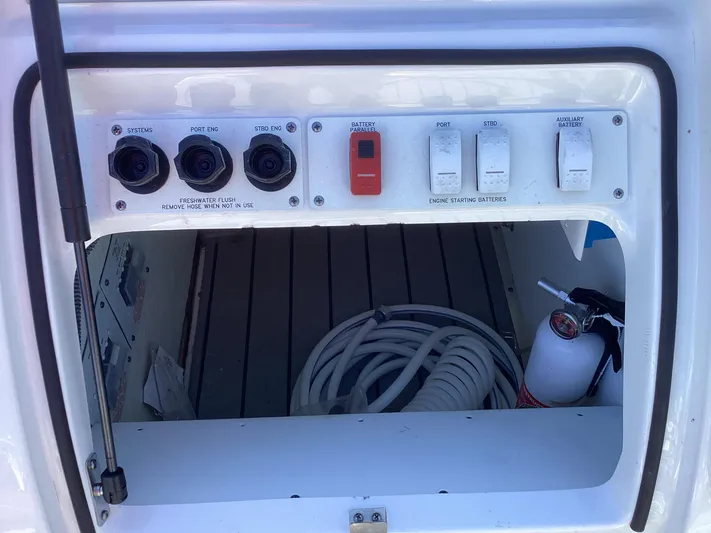 Steal Yacht Photos Pics 2020 Formula 380 Super Sport Crossover control panel with switches and coiled hose.