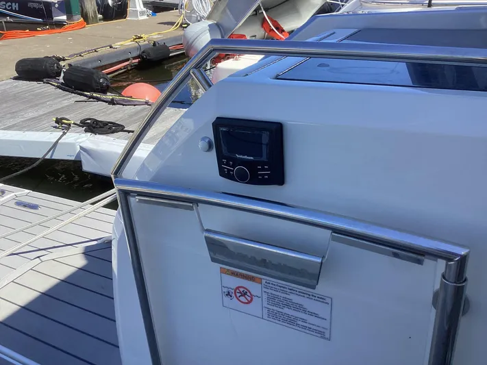 Steal Yacht Photos Pics 2020 Formula 380 Super Sport Crossover boat docked, featuring control panel and safety instructions.