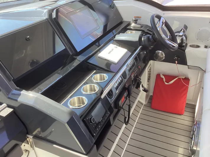 Steal Yacht Photos Pics 2020 Formula 380 Super Sport Crossover cockpit with modern controls and cup holders.