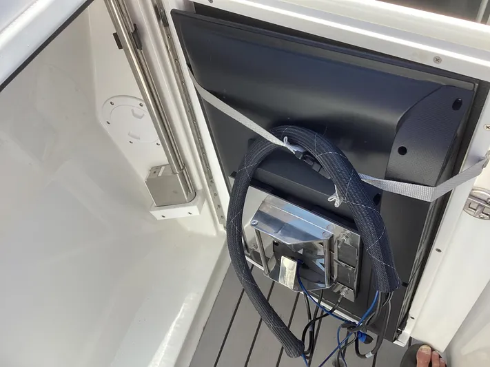 Steal Yacht Photos Pics 2020 Formula 380 Super Sport Crossover interior with mounted equipment and wiring.