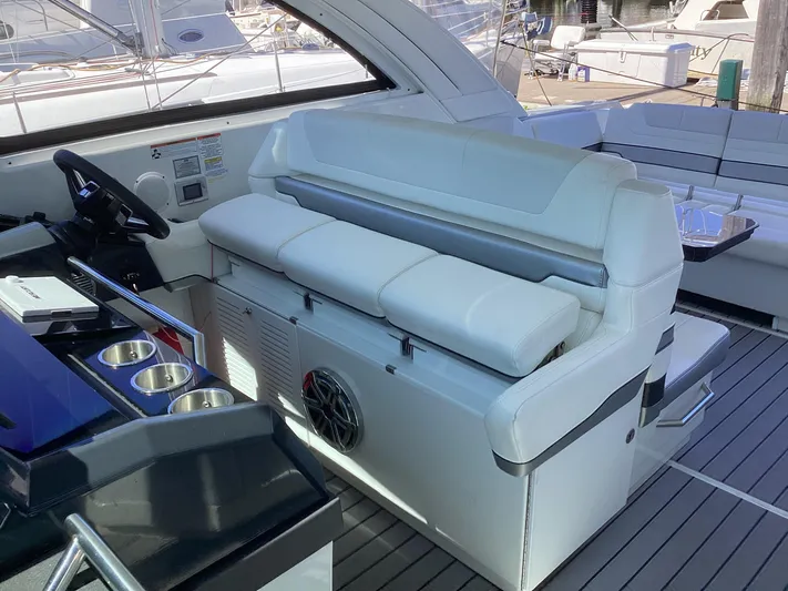 Steal Yacht Photos Pics 2020 Formula 380 Super Sport Crossover interior with white seating and modern helm.