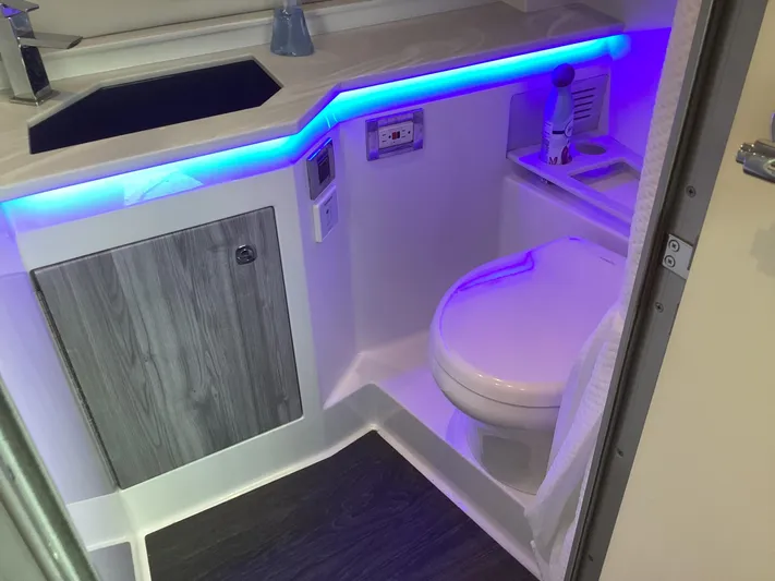 Steal Yacht Photos Pics 2020 Formula 380 Super Sport Crossover bathroom with modern design and blue LED lighting.