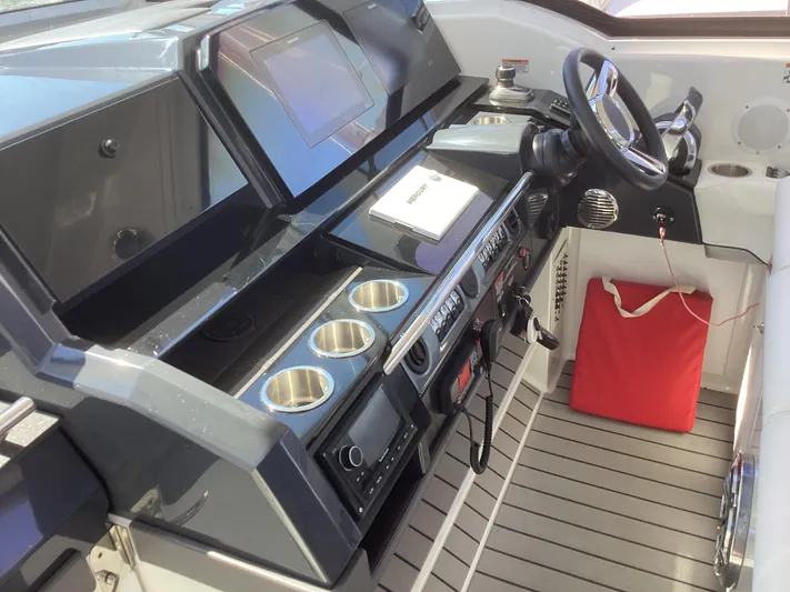 Steal Yacht Photos Pics 2020 Formula 380 Super Sport Crossover helm with modern controls and cup holders.