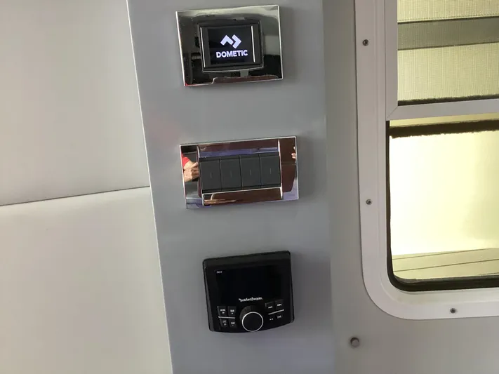 Steal Yacht Photos Pics Control panel in a 2020 Formula 380 Super Sport Crossover boat interior.