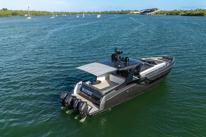 Matzu Yacht Photos Pics 2023 Azimut Verve 47 luxury yacht cruising on a serene blue waterway.
