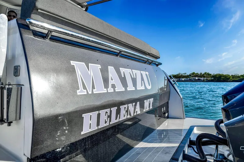 Matzu Yacht Photos Pics 2023 Azimut Verve 47 yacht on water, featuring sleek design and "MATZU" name.