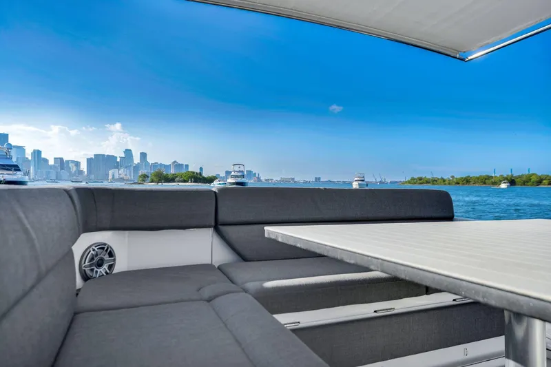 Matzu Yacht Photos Pics 2023 Azimut Verve 47 yacht interior with city skyline and ocean view.