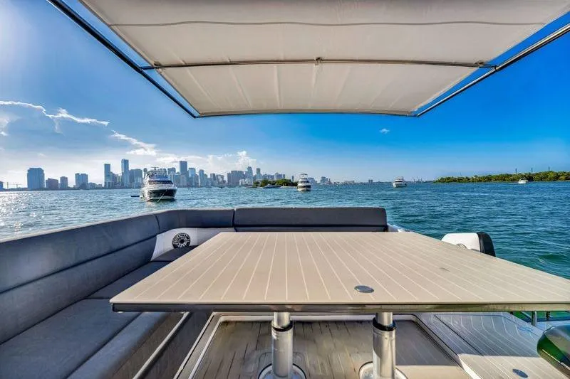 Matzu Yacht Photos Pics 2023 Azimut Verve 47 yacht with city skyline and ocean view.