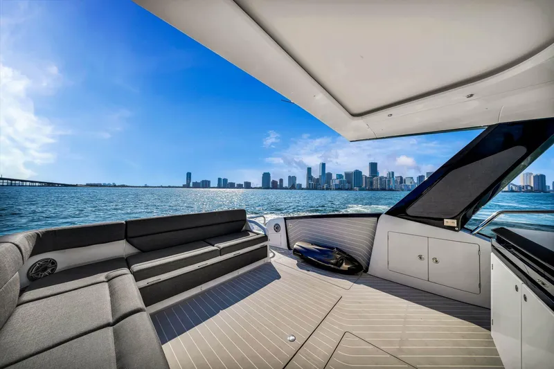Matzu Yacht Photos Pics 2023 Azimut Verve 47 yacht interior with city skyline view, luxurious seating, and modern design.