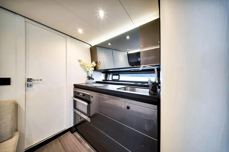 Matzu Yacht Photos Pics Luxurious kitchen interior of 2023 Azimut Verve 47 yacht, featuring modern appliances and sleek design.