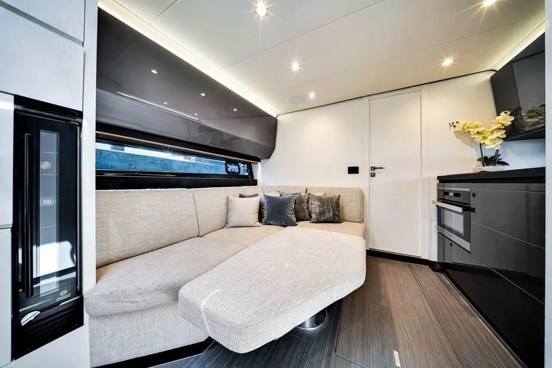 Matzu Yacht Photos Pics Luxurious interior of 2023 Azimut Verve 47 yacht with modern sofa and sleek kitchen.