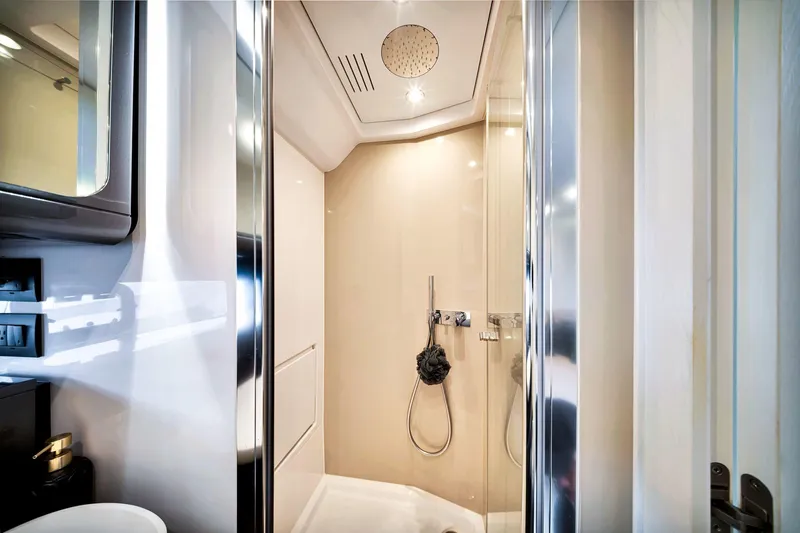 Matzu Yacht Photos Pics Luxurious bathroom interior of 2023 Azimut Verve 47 yacht, featuring modern shower design.