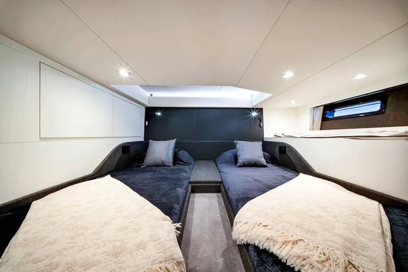 Matzu Yacht Photos Pics Luxurious cabin interior of 2023 Azimut Verve 47 yacht with twin beds and modern lighting.