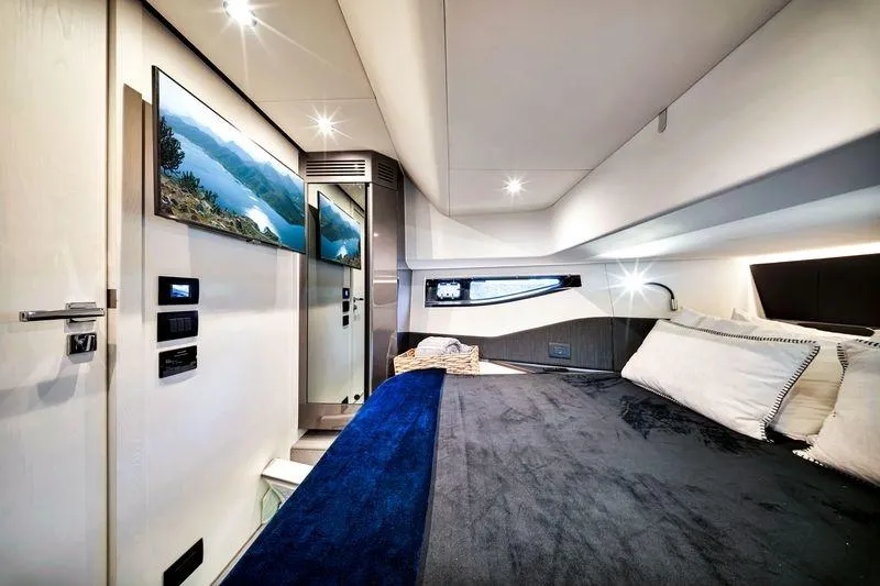 Matzu Yacht Photos Pics Luxurious interior of 2023 Azimut Verve 47 yacht with modern design and cozy bedding.