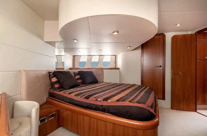 M/y Seaduced Yacht Photos Pics Luxurious bedroom interior of 2009 Sunseeker Predator 52 yacht with modern design.