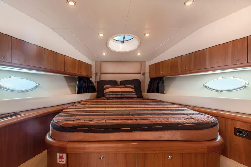 M/y Seaduced Yacht Photos Pics Luxurious cabin interior of 2009 Sunseeker Predator 52 yacht with elegant wood finish.