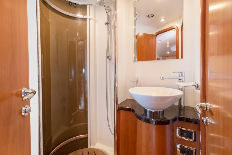 M/y Seaduced Yacht Photos Pics Luxurious bathroom in 2009 Sunseeker Predator 52 yacht with modern shower and basin.