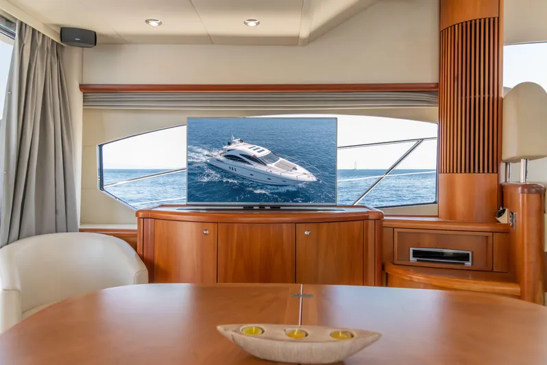 M/y Seaduced Yacht Photos Pics Luxurious interior of 2009 Sunseeker Predator 52 yacht with ocean view.