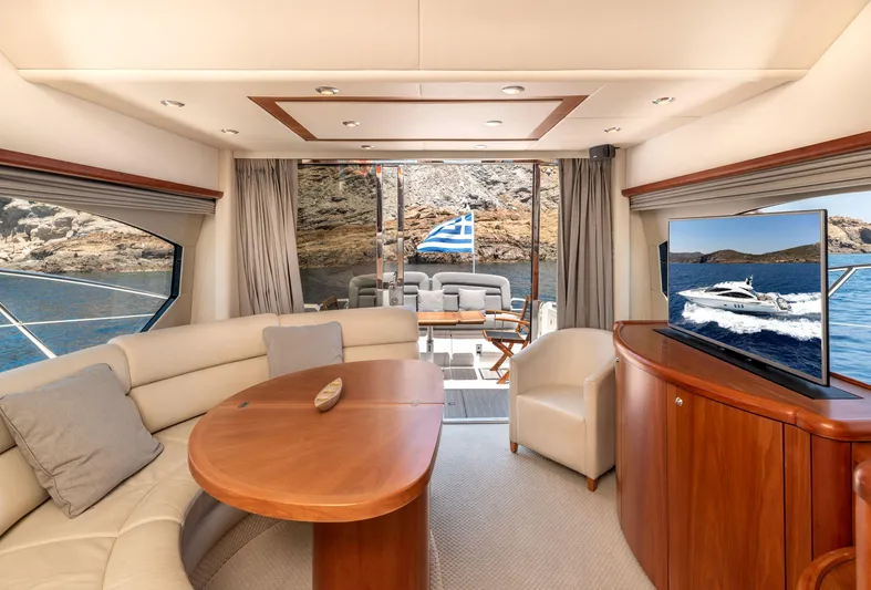 M/y Seaduced Yacht Photos Pics Luxurious interior of 2009 Sunseeker Predator 52 yacht with elegant seating and scenic views.