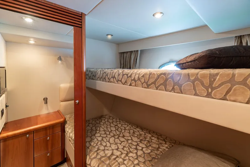 M/y Seaduced Yacht Photos Pics Bunk beds in 2009 Sunseeker Predator 52 yacht cabin with wooden cabinetry.