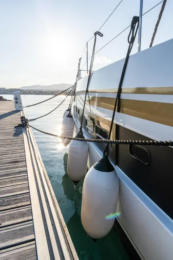 Signature Bali 5.4. (5+2 Cabins) Yacht Photos Pics Bali 5.4 catamaran docked at marina, sunlit, 2021 model.