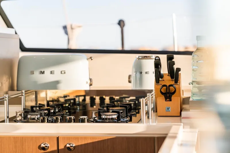 Signature Bali 5.4. (5+2 Cabins) Yacht Photos Pics Modern kitchen with Smeg appliances and knife set on a Bali 5.4 yacht, 2021 model.