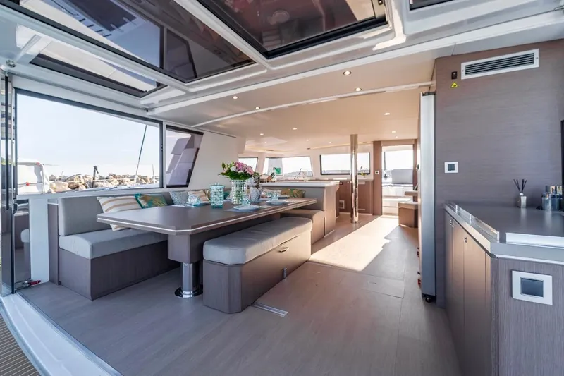 Signature Bali 5.4. (5+2 Cabins) Yacht Photos Pics Luxurious interior of 2021 Bali 5.4 yacht with elegant dining area and modern design.