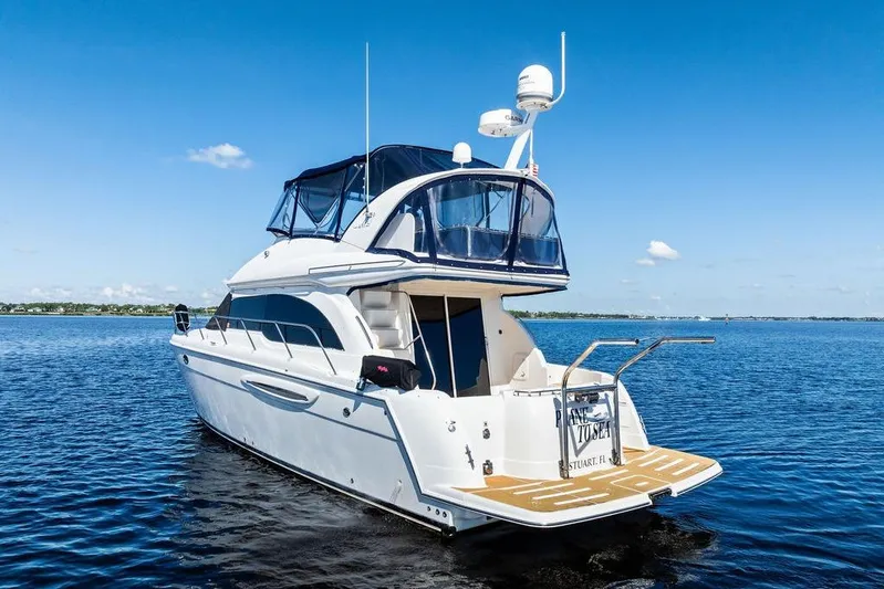 Yacht Photos Pics 2008 Meridian 411 Sedan yacht on calm blue water under clear sky.