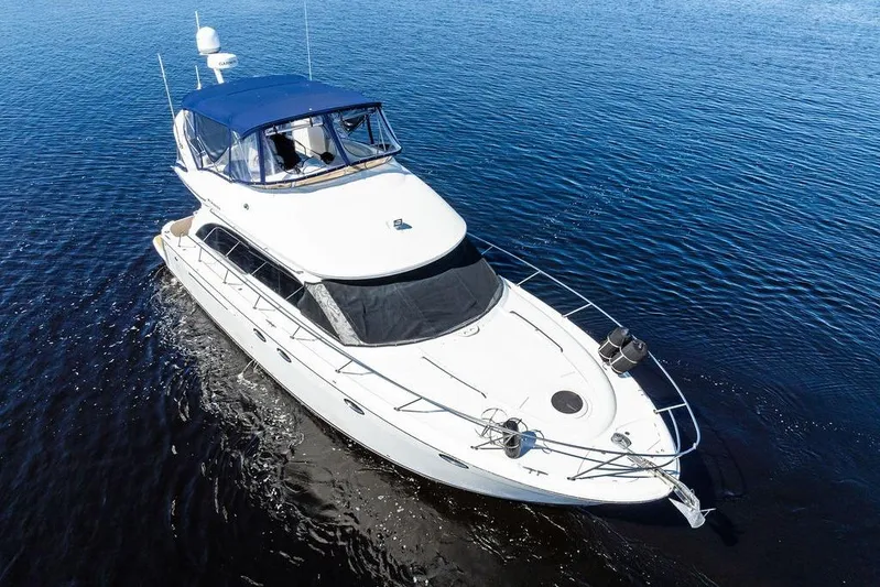  Yacht Photos Pics 2008 Meridian 411 Sedan yacht cruising on calm blue waters.