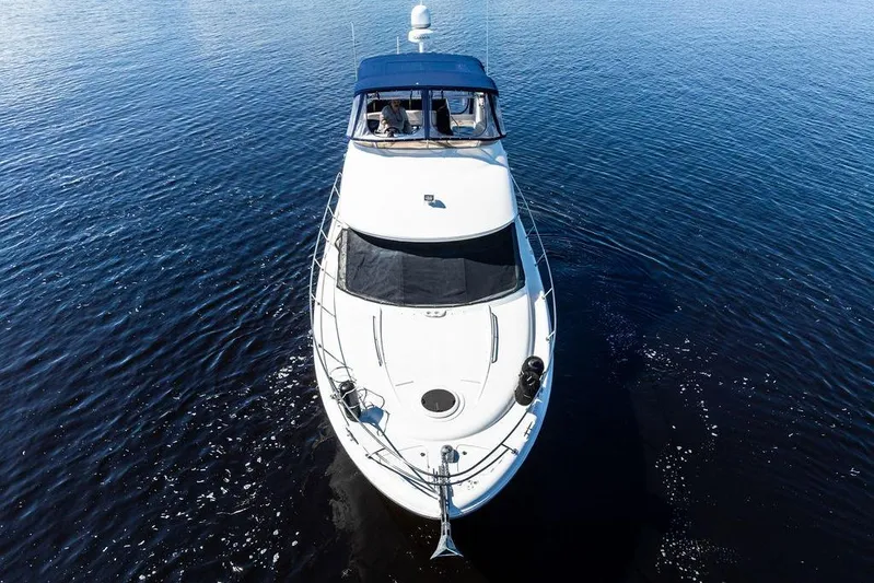  Yacht Photos Pics 2008 Meridian 411 Sedan yacht cruising on calm blue waters.