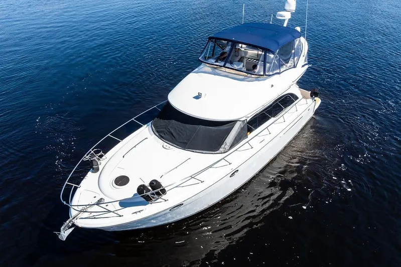  Yacht Photos Pics 2008 Meridian 411 Sedan yacht cruising on calm blue waters.