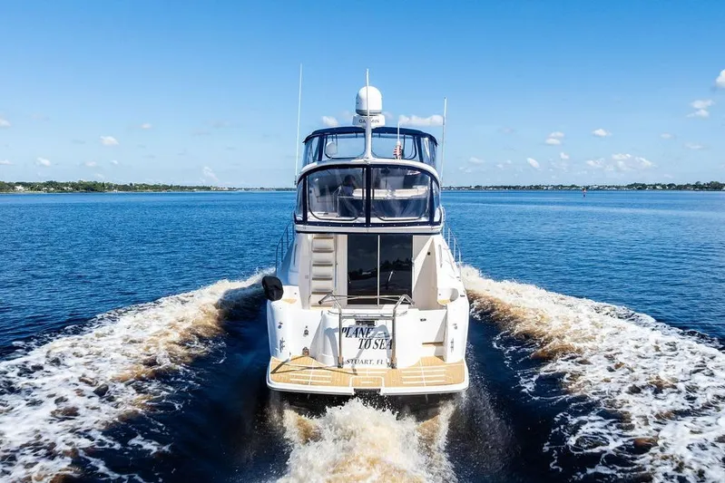  Yacht Photos Pics 2008 Meridian 411 Sedan cruising on open water under clear blue skies.